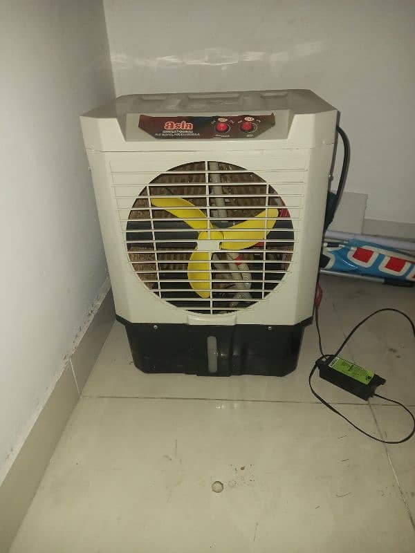 1 wall fan and 1 mini cooler 1