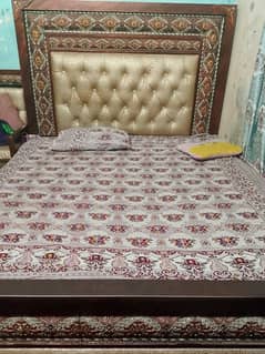 Bed with side table or dressing table