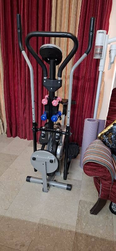 Elliptical bike with twister and dumbells 1