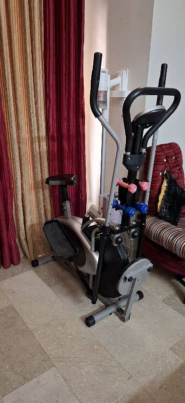 Elliptical bike with twister and dumbells 3