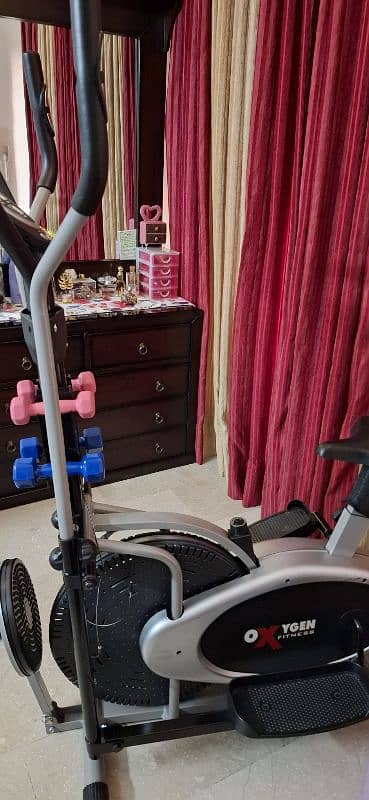 Elliptical bike with twister and dumbells 4