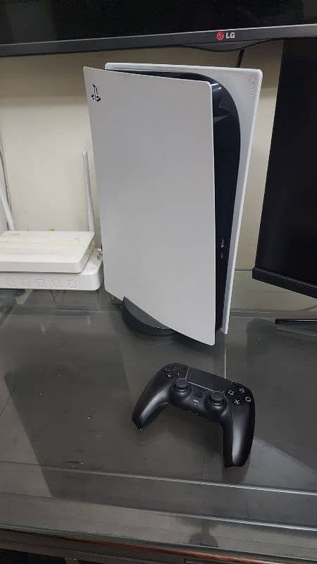 PlayStation 5 with controller 1