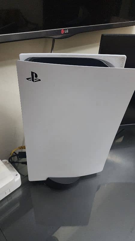 PlayStation 5 with controller 3