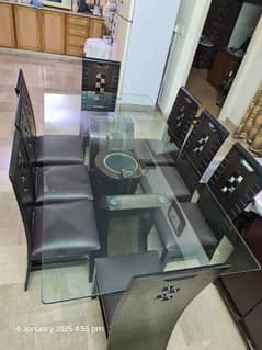 Glass dining table with 8 chairs