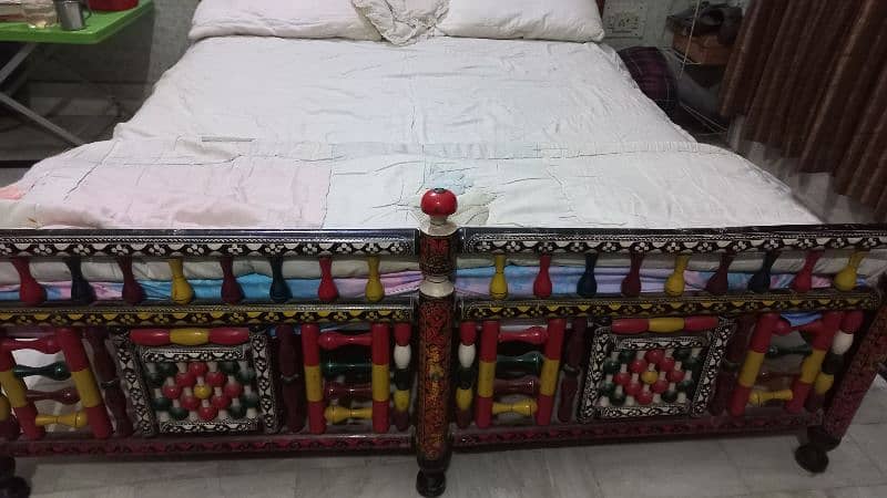 Ethnic multicolor wooden bed and sofa with intricate design 1