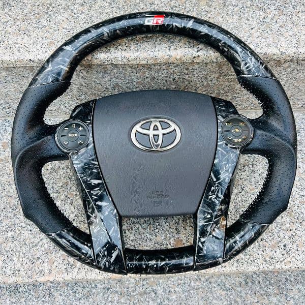 Toyota Prius + Aqua carbon fiber steering available 3