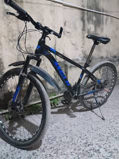 black and blue mtb cycle