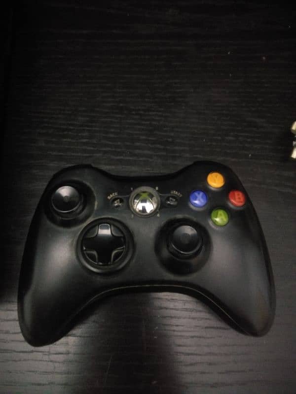 Xbox 360 with upto 15 games and two  wireless controllers 0