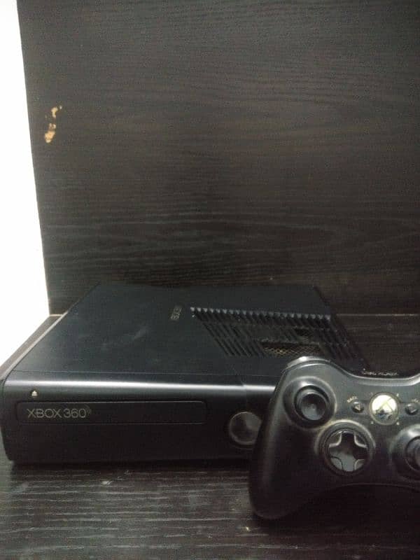 Xbox 360 with upto 15 games and two  wireless controllers 2