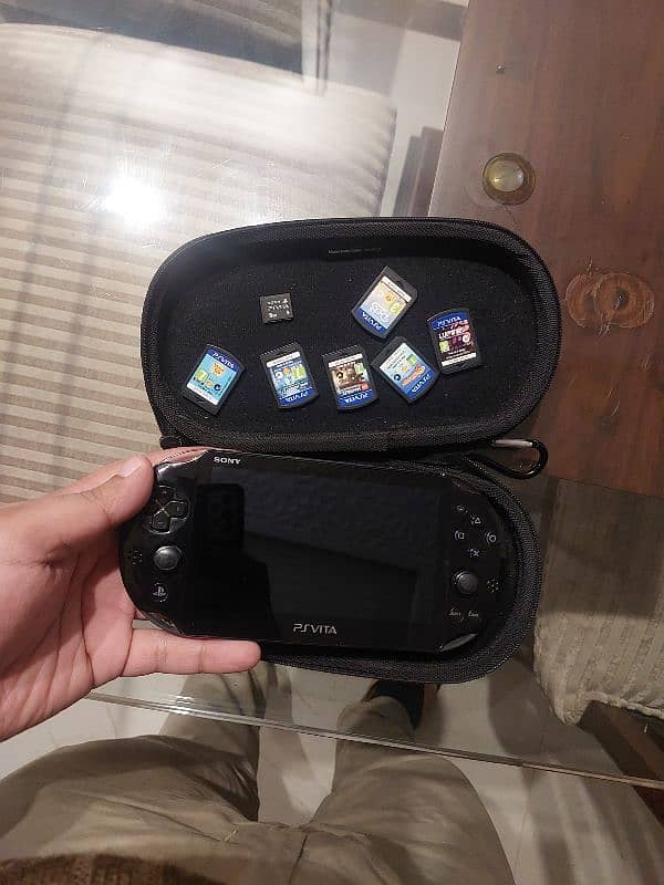 ps vita with 6 games & 2 card 0