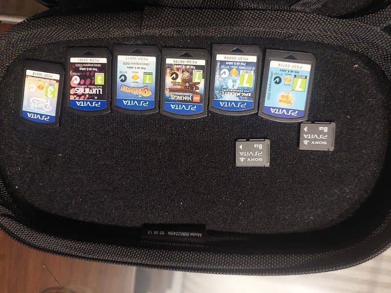 ps vita with 6 games & 2 card 1