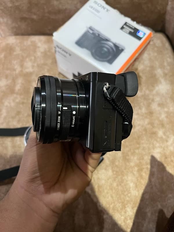 sony 6100 with 50mm 1.8 lens and box 7