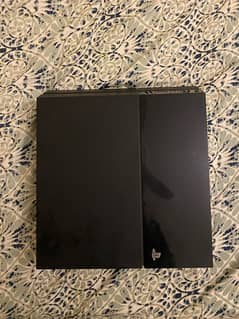 ps4 console with 2 controllers and 4 games