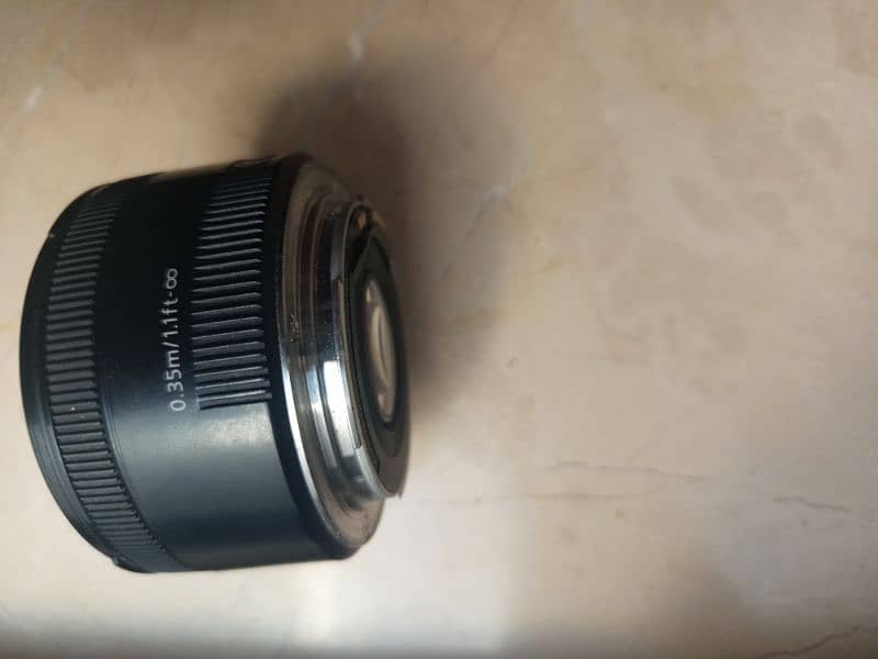 cannon 50  stm mm lence 1.8 new condition only 2 weeks use 2