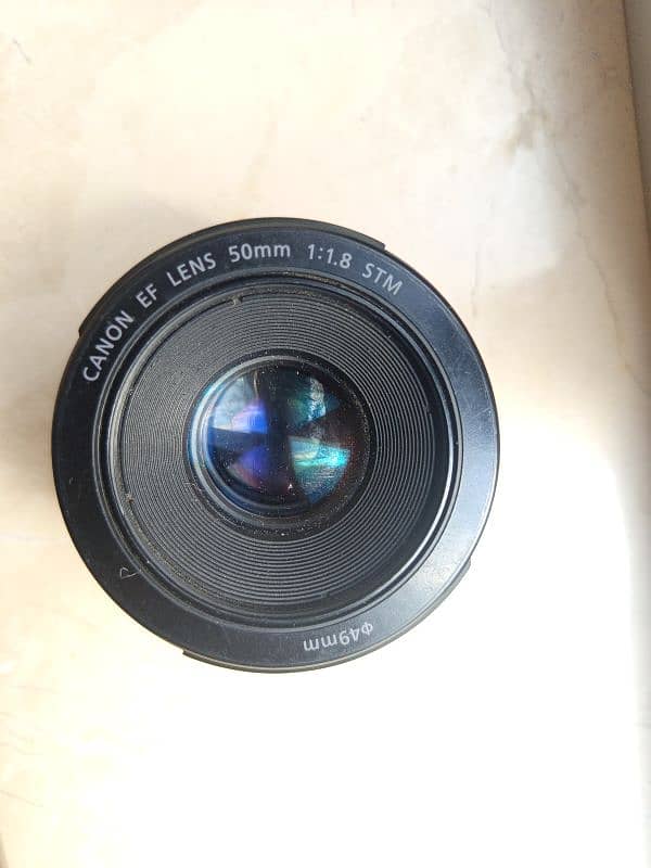 cannon 50  stm mm lence 1.8 new condition only 2 weeks use 7