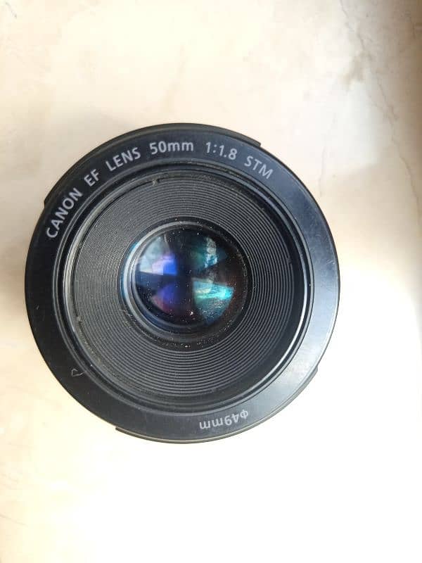 cannon 50  stm mm lence 1.8 new condition only 2 weeks use 8