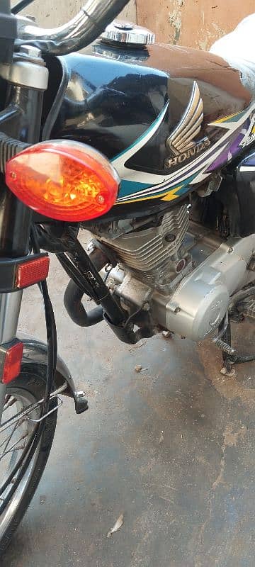 Honda 125 model 2020 larkana number 7