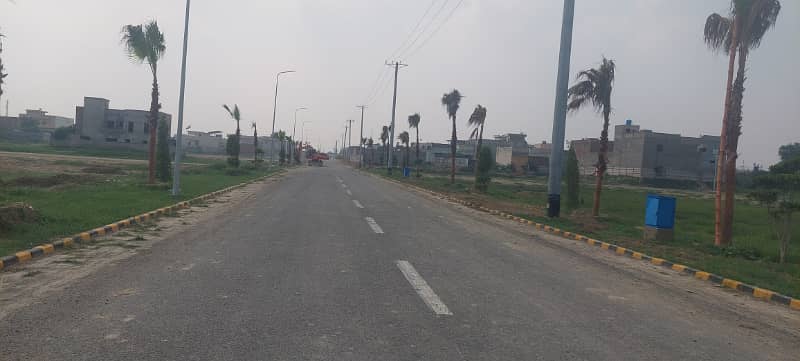 At main Road 1 Kannal Plot for sale in woods Block in Paragon City Lahore 0