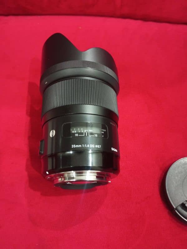 sigma lens 35mm F1.4 DG HSM Canon for sale slightly used. 9