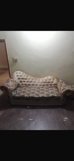 1 couch with 2 chairs along with a centre table