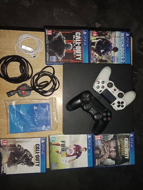 Ps4 slim with 2 original controllers and 5 games cd 0