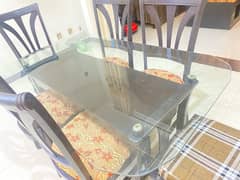 six seater  dining table with glass top