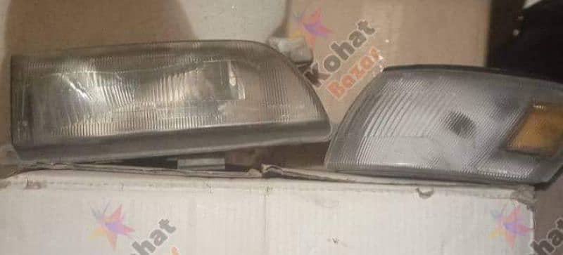 corolla 3 pieces front grills and  head lights 1