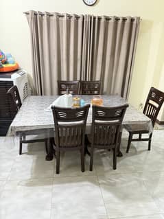 Glass dinning table with 6 wooden chairs