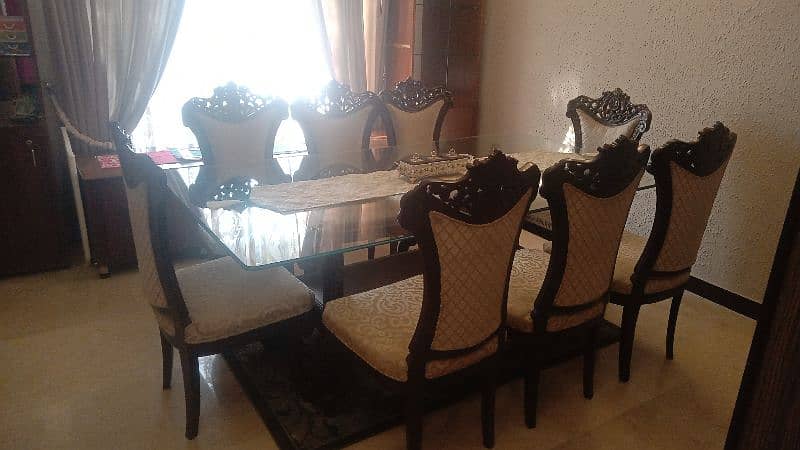 Shesham woodDining table with 8 chairs condition is very good 0