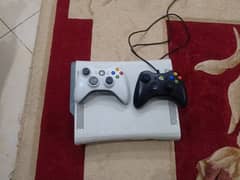 Xbox 360 with two controllers