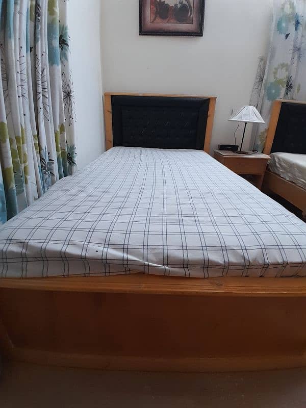 2 single wooden beds with spring mattresses 5