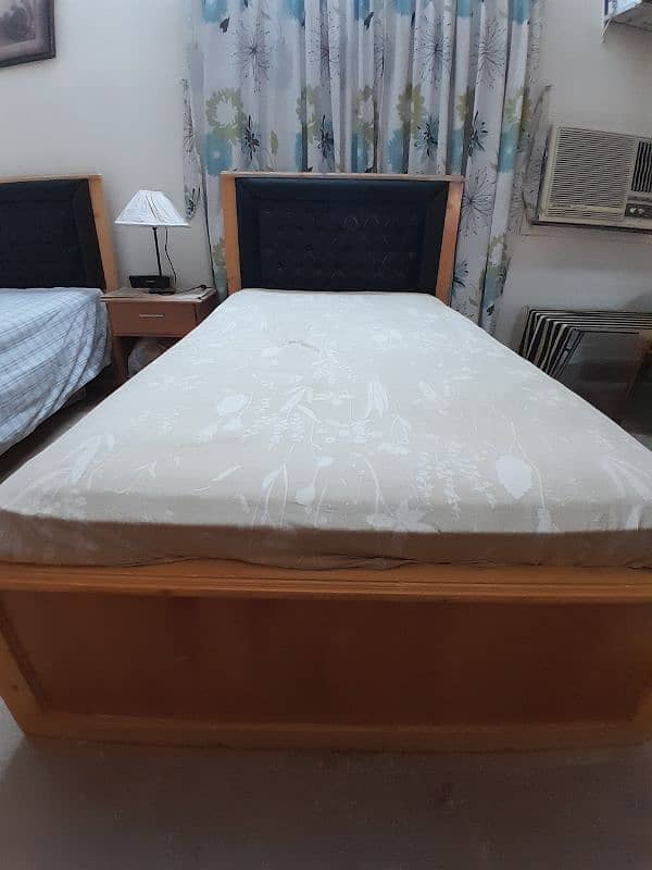 2 single wooden beds with spring mattresses 6