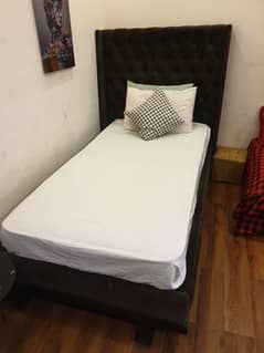 large single bed for sale with spring mattress and side table