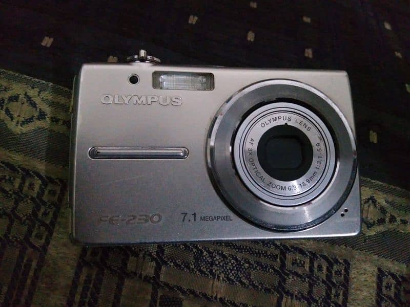 Olympus digital camera FE-230 battrey and focus problm for sel 1