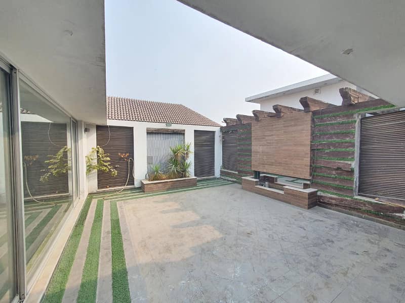 Well Maintained One Kanal Designer Bungalow Available For Rent Near Main Road Hot Location 23