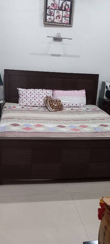 wooden double bed 0