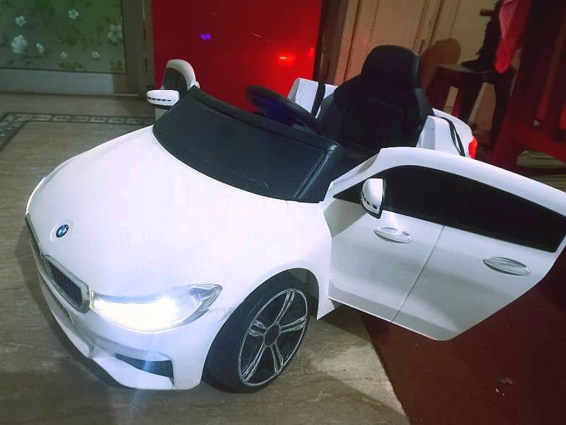 Kids BMW car with remotecontrol & swing rocking mode/doors opening 1