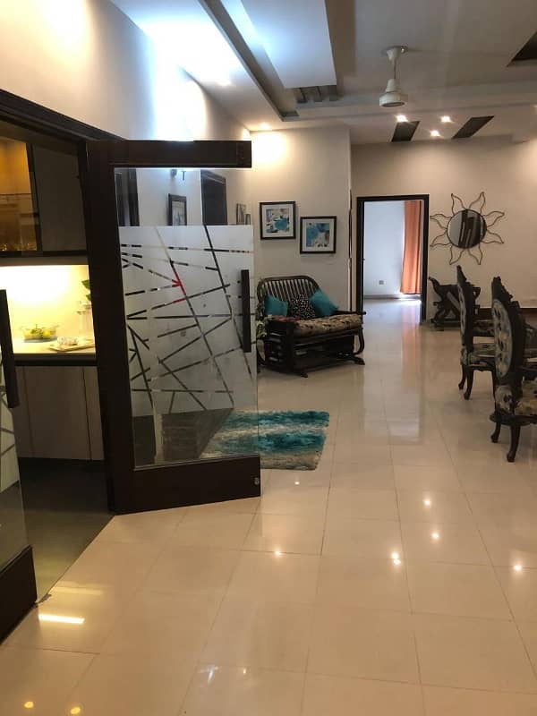 Kanal tile floor 6bed double story house is for sale in Wapda town 8