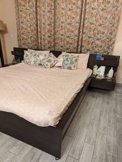 king bed with attached side tables