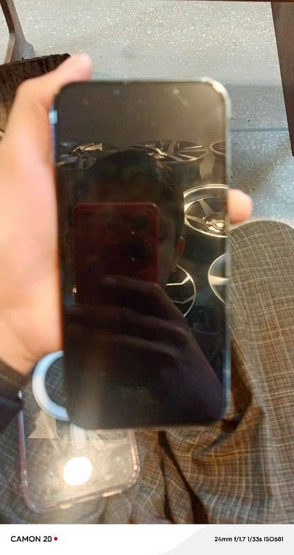 iPhone 13 promox 128 GB water pack phone 10 by9.5 condition box phone 5