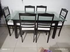 glass top + wooden base dining table with 6 chairs