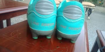 Line seven football shoes with new lases