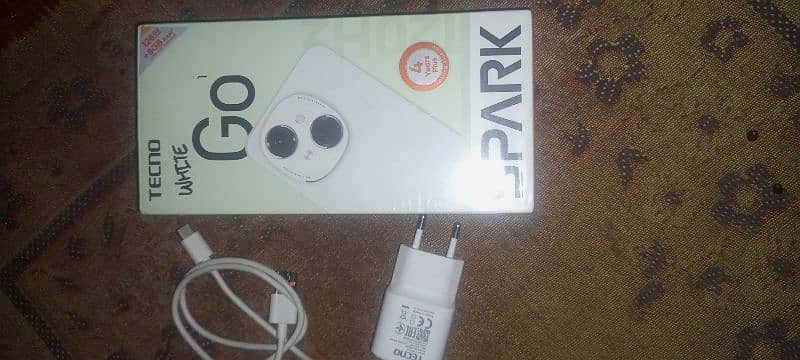 Tecno spark go 1. . (4/128). . Full warranty box accessories available. 0