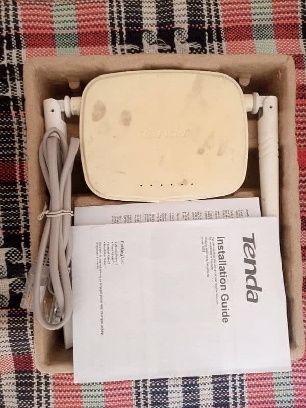 Tenda wifi router available for sale with box and cable and manual 3