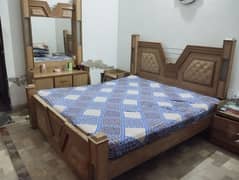 bed with side table and dressing tabile