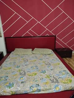 low hight king size bed with two side tables