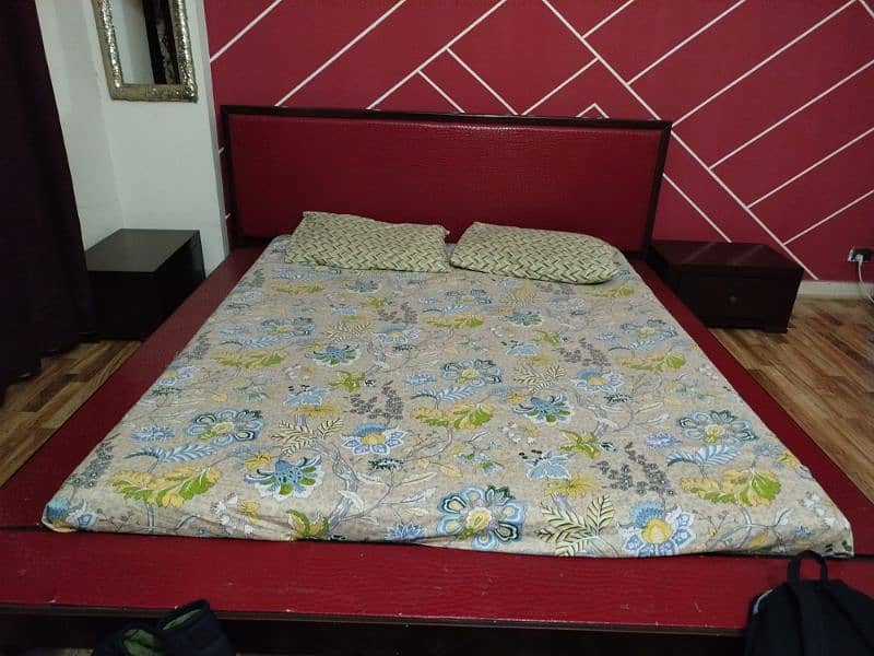 low hight king size bed with two side tables 1