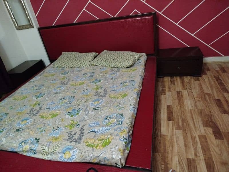 low hight king size bed with two side tables 2