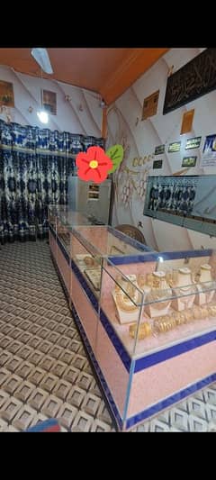 jewelry shop stoke for sale. chairs,counter,metal safe,wall grass,flow