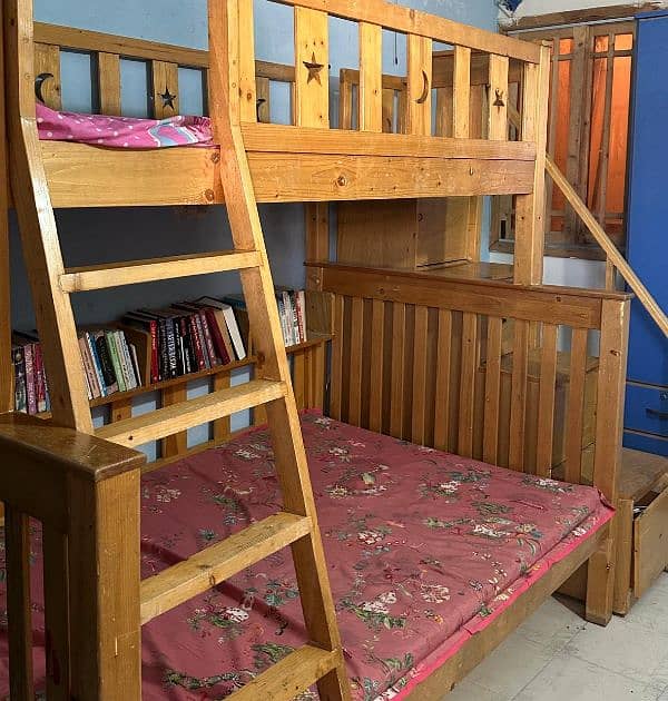 Used wooden bunker bed with a third sliding bed under. 3